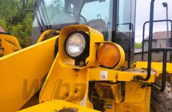 Wspornik lampy lewy,przód do ładowarki Hyundai HL760-7 